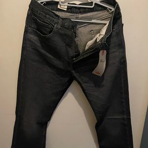 Levi’s black pre washed stretch jeans 505. Size 34w 29l. NWT